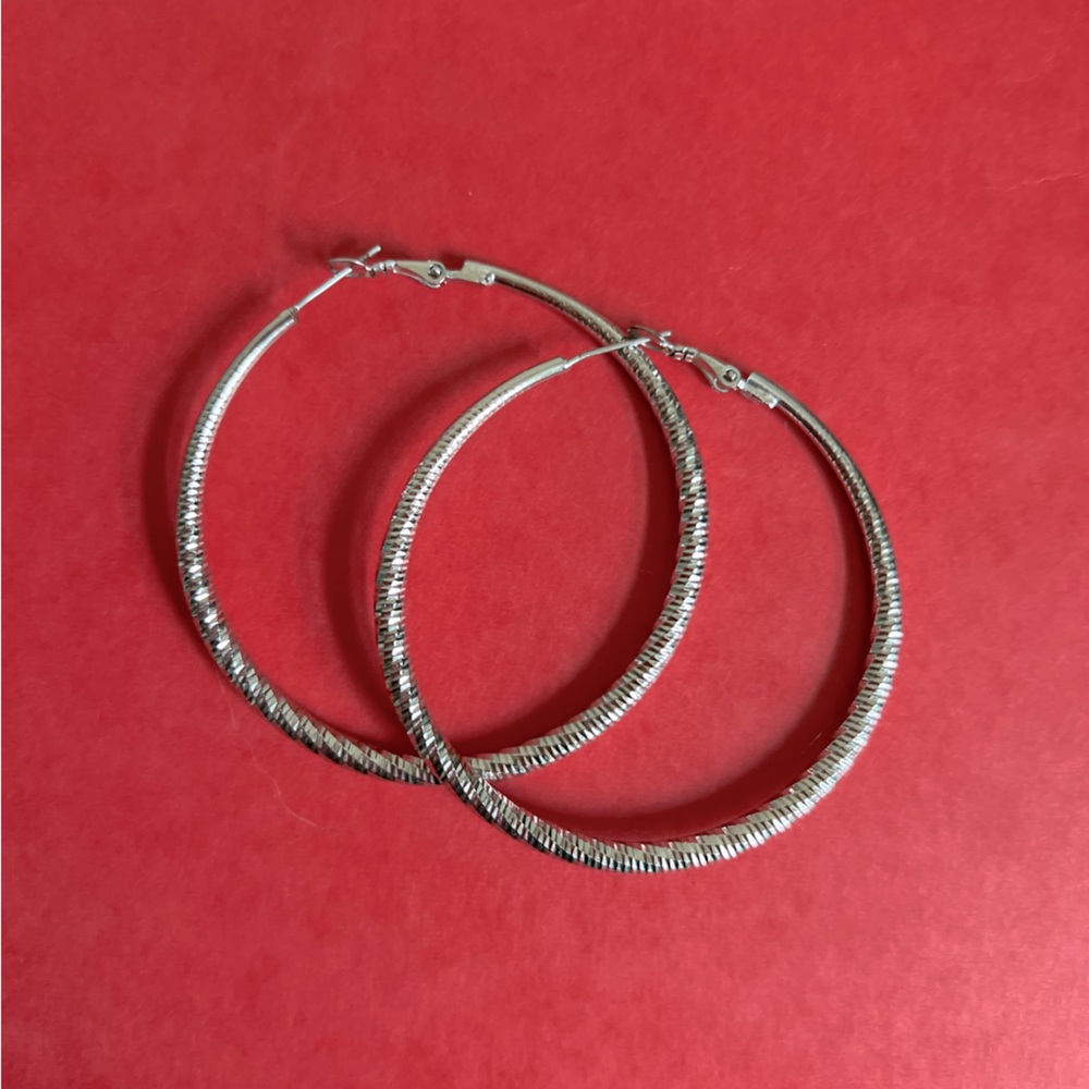 Silver Tone Hoop Tornado Diamond Cut Earrings